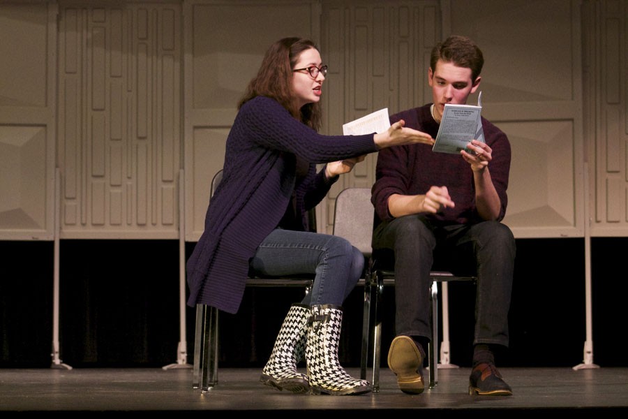 Rehearse to impress: Seniors Genevieve Bone and Charlie Berg argue over directions to a dinner party at rehearsal Dec. 18.
