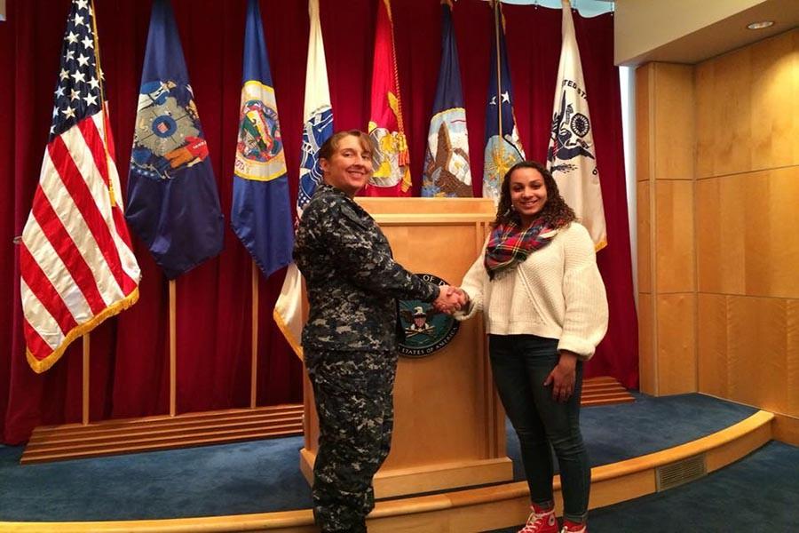 After signing with the National Guard, junior Aprille Lopac shakes hands with a representative Feb. 13. Lopac said she decided to join the National Guard because she wants to have a purpose as she decides on a career path.