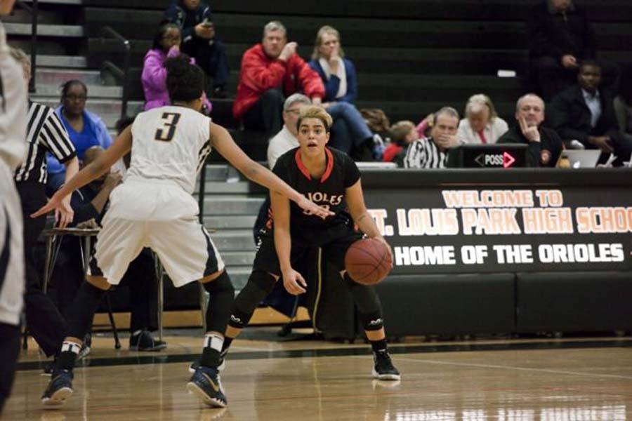 Senior Mara Henderson dribbles the ball at the game Feb. 5 against Bloomington Kennedy where Park won 74-66. Henderson recently reached the 1,000 point mark. The Orioles next game is 7 p.m. Feb. 12 against Robbinsdale Cooper. 