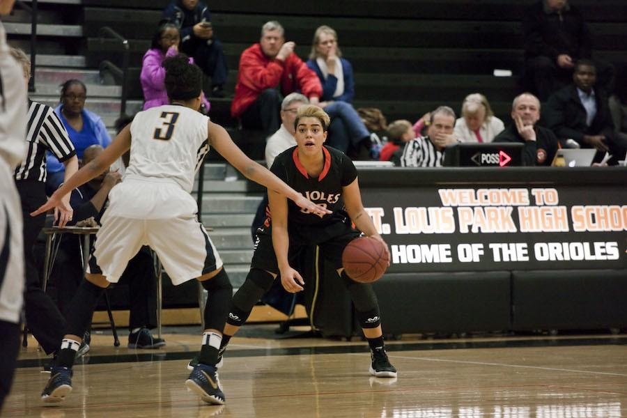 Senior Mara Henderson dribbles the ball at the game Feb. 5 against Bloomington Kennedy were Park won 74-66. Henderson recently reached the 1,000 point mark. The Orioles next game is 7 p.m. Feb. 12 against Robbinsdale Cooper