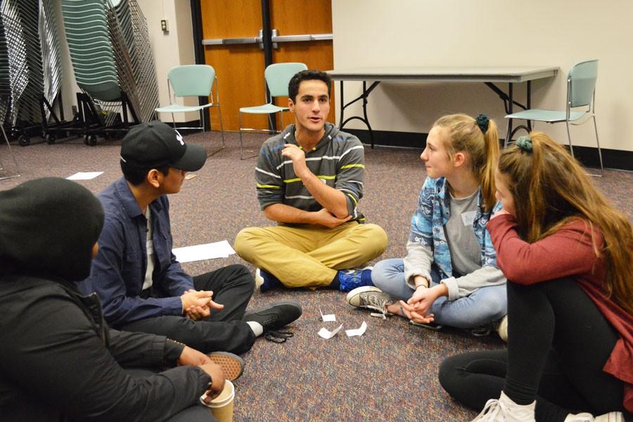 Senior Justin Less participates in a group exercise during the Natural Helpers training day.