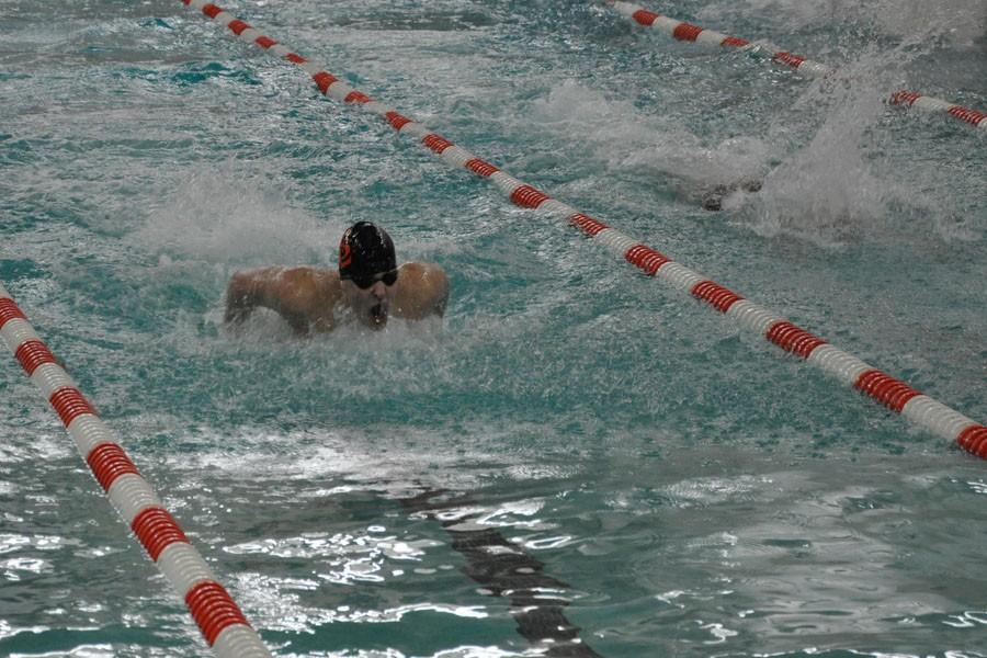 Junior Captain Nate Stone competes in the 100 butterfly to help raise St. Louis Park to a 55-39 win over Benilde.