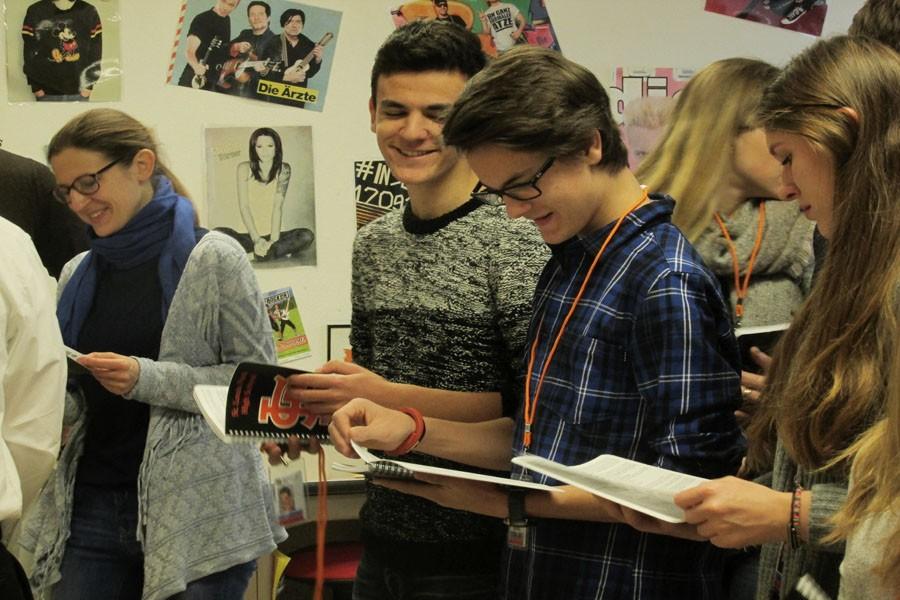 German exchange students read their St. Louis Park High School handbooks given to them Feb. 8. 