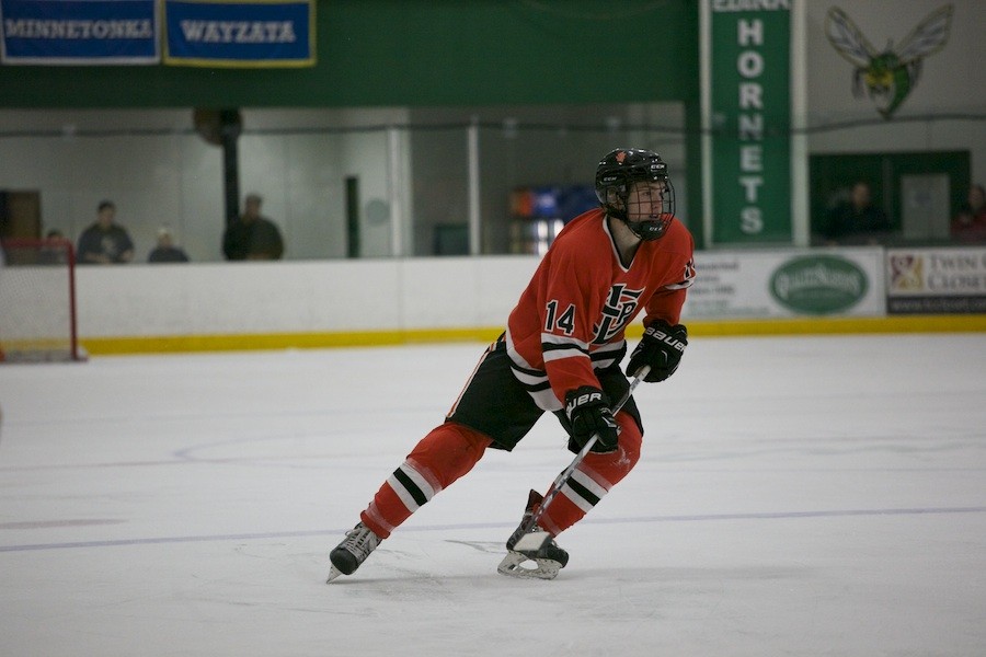 Junior Park hockey player Grant Plender waits for a pass as he skates wide open at the game against Edina Feb.18. 