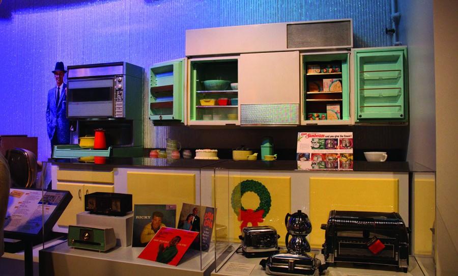 Peek into modernity: Contemporary kitchen and household appliances are displayed at the exhibit. Records and a music player are also showcased.