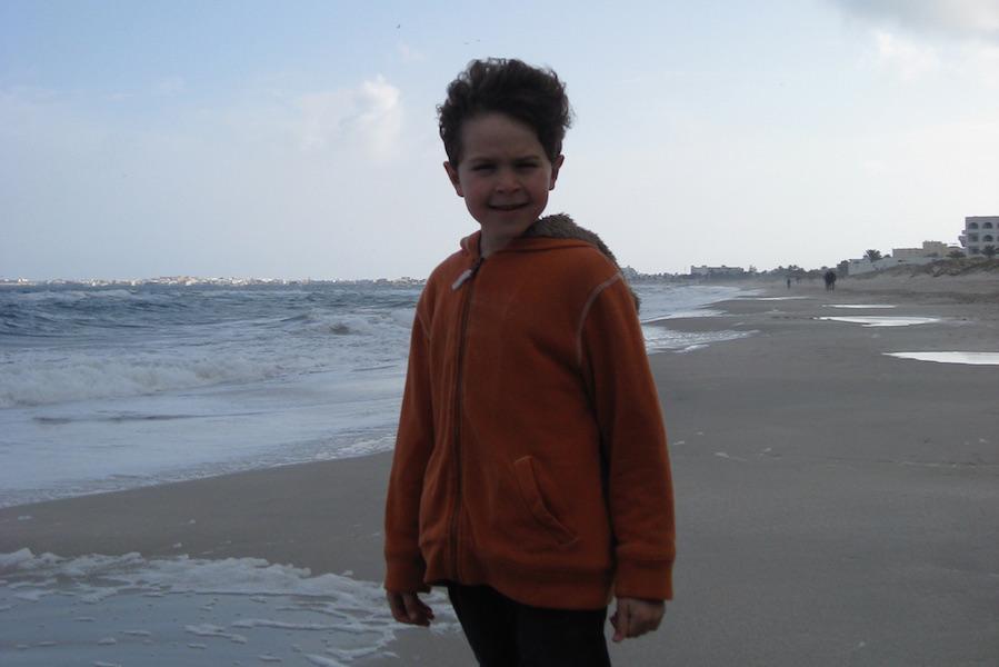 Freshman Brahim Bouzrara stands on a beach in Tunisia during his last visit in 2008. Bouzraras father is from Tunisia, making this culture a big part of Bouzraras life.