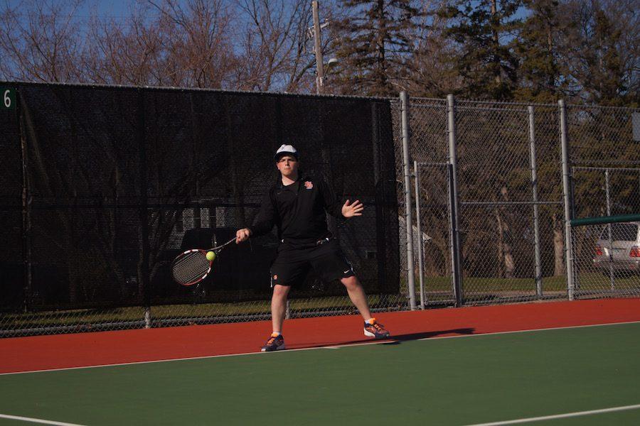 Junior Jared Zirkes prepares to take a shot April 13 at his tennis scrimmage against Providence Academy. The varsity team has their first match 4 p.m. April 20 at the St. Louis Park High School tennis courts. 