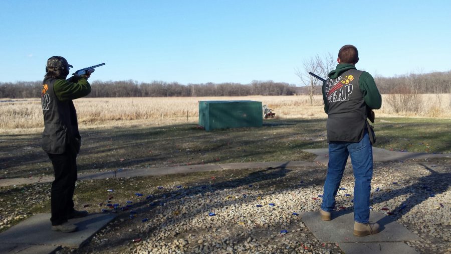 Two trap team members aim their guns April 11 during practice.