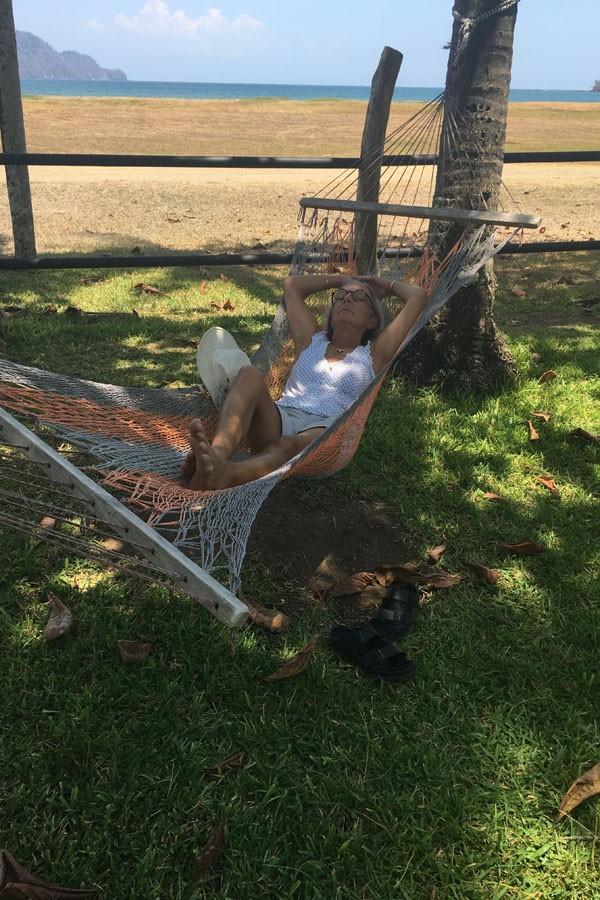 Mary Norris relaxes by the beach in a hammock on her vacation in 2016. She will return to teaching after spring break.