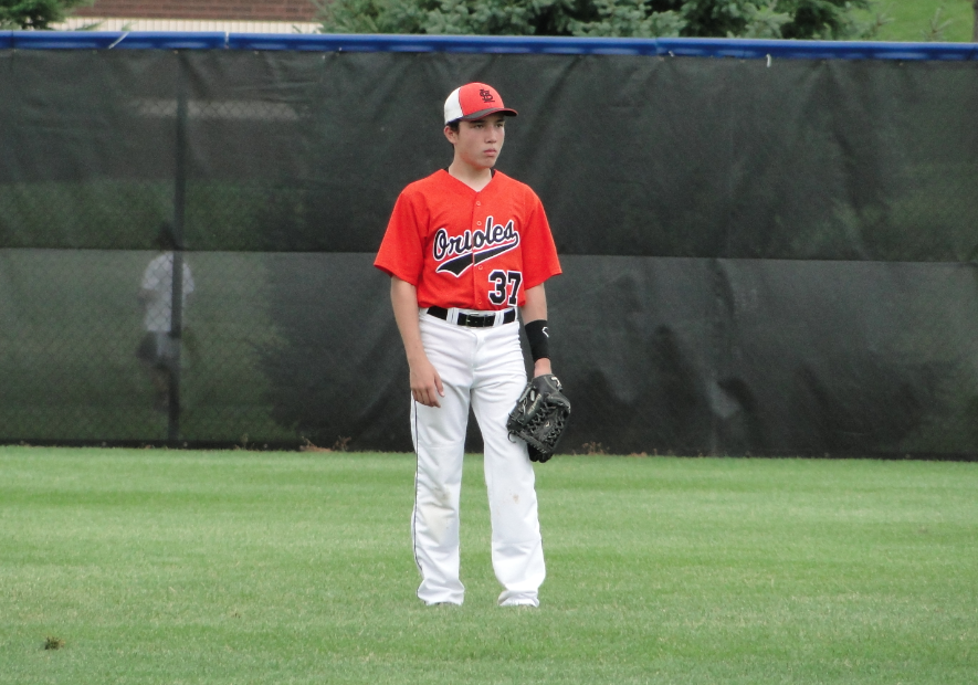 Sophomore Kai McKee stands in the center field during a baseball game. McKee said he aspires to play for the Japanese team, the Chunichi Dragons.