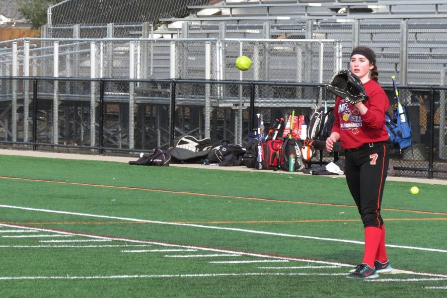 Freshman Savannah Romero concentrates on catching the ball as she plays first base at an early season practice March 31.