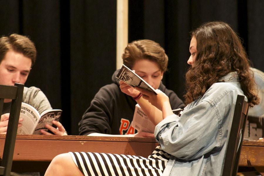 Senior Charlie Berg, junior Lukas Levin and sophomore Annabella Strathman rehearse their lines for the play Twelve Angry Jurors April 5.
