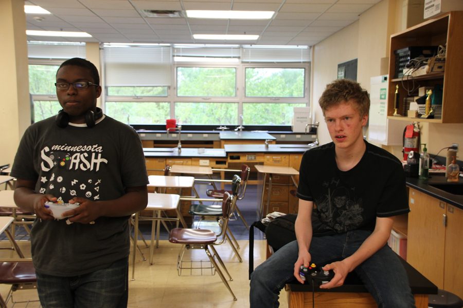 Sophomore Jeffery Robinson and freshman Christopher Anondson play games in Peter Dangerfields room May 12.