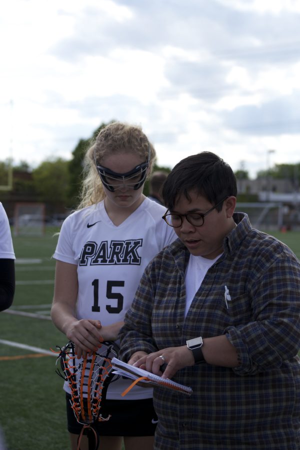 New girls lacrosse coach Amanda Loth works with JV team members before their game May 16 against Visitation/St. Paul Academy. JV and Varsity both play against Benilde St. Margerets May 19 at 5:30 and 7 p.m. at the home stadium. The teams next game is May 19.