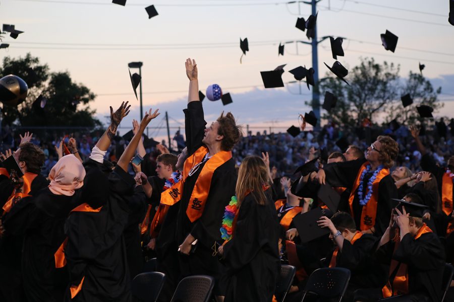 Graduates throw their caps in the air at the end of the 2016 Graduation ceremony, celebrating the end of their high school career. Graduation 2017 will be held May 25 outside at the football field, weather permitting. 