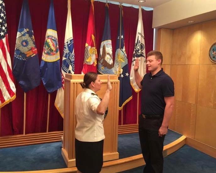 Junior Eli Haddorff reciting the oath before getting sworn into the U.S. Marine Corps. Photo used with written permission from Eli Haddorff.