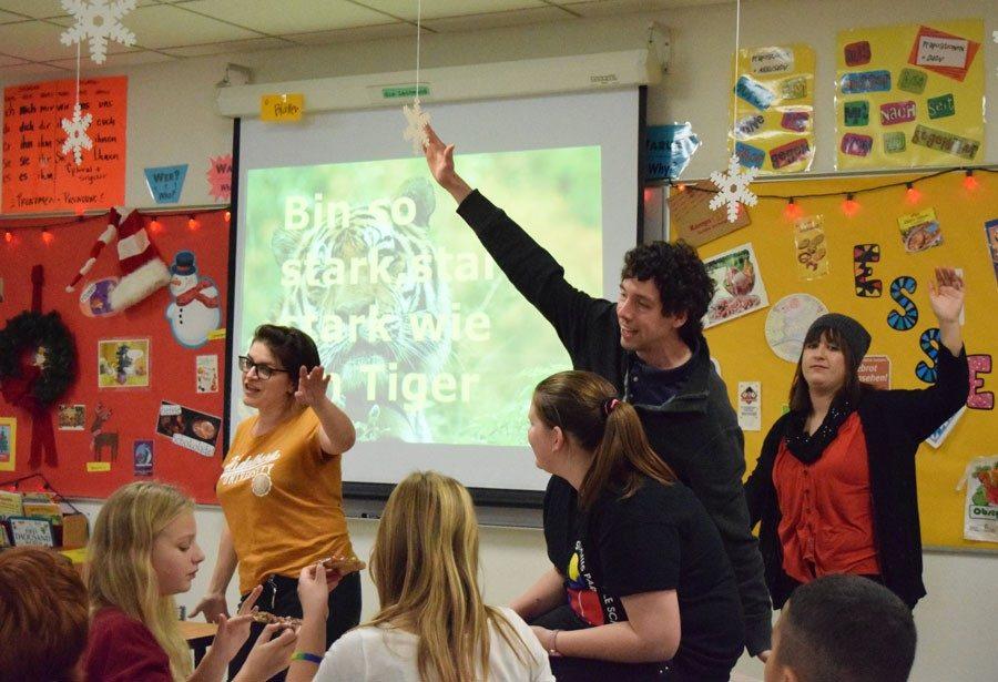 German club teachers dance to a song sung in german while students enjoy their treats. German club is available for students in grades 6-12.