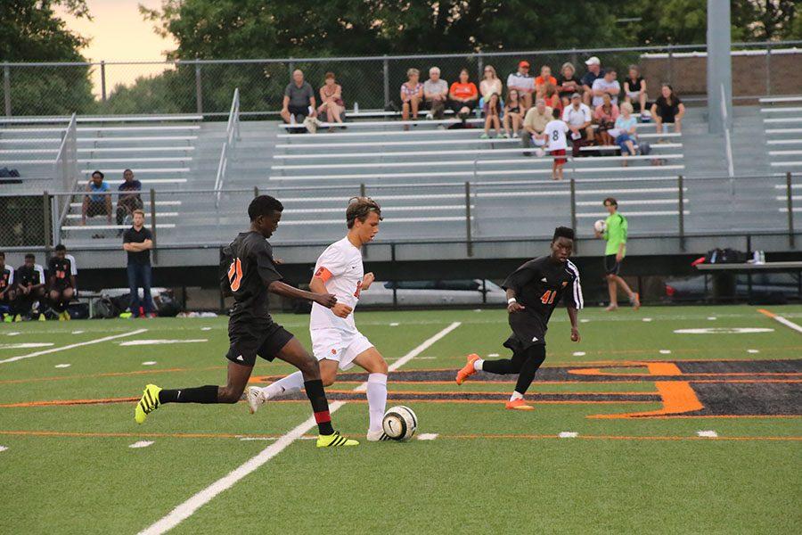 Senior Miguel Ocampo, a midfielder, charges the ball across the field during Aug. 29 varsity game vs. St. Cloud Tech. Ocampo is one of this years Boys Soccer team Captains. The next Boys Soccer home game is Sep. 13 against Kennedy at 7 p.m.  