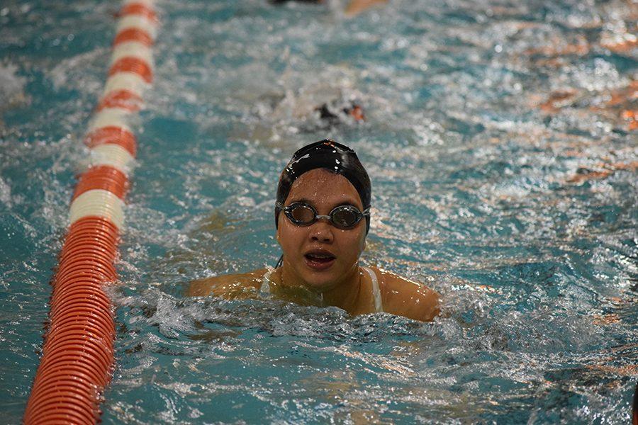 Slp girls swimmer catching her breath after practicing for her meet on August 29 against Richfield.