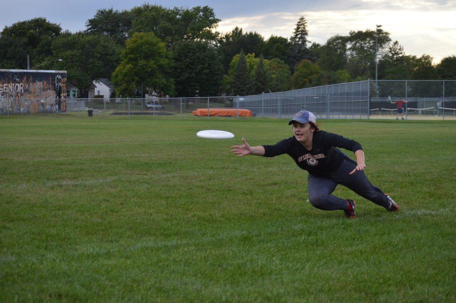 Senior Anna Gleason lays out in order to catch the Frisbee. The team’s next game takes place Sept. 24 at West Minnehaha Recreation Center against Minneapolis South. 