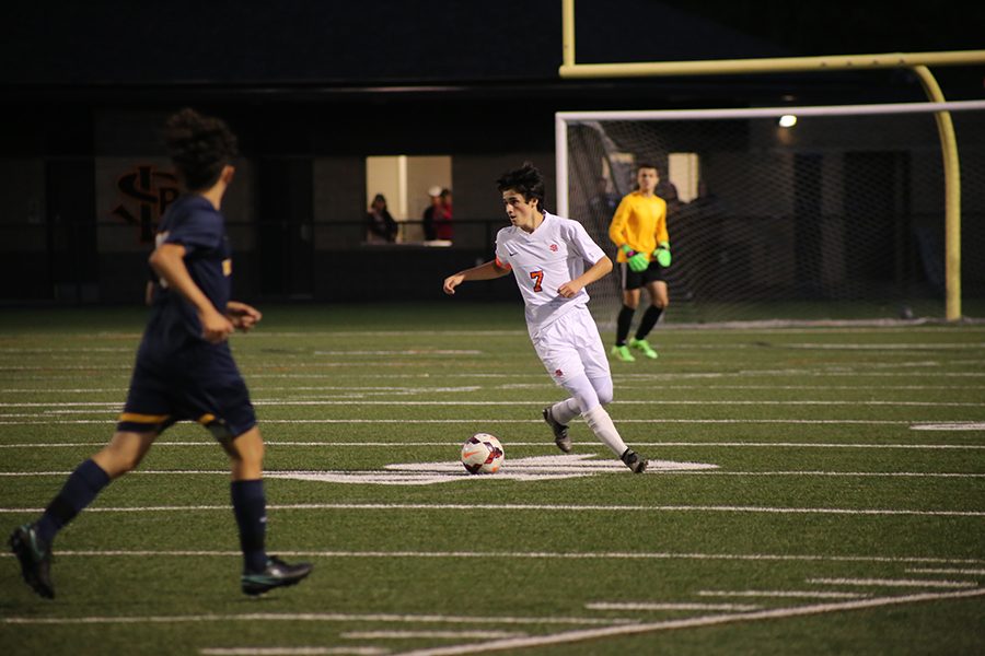 Junior captain Anthony Brandel plays defense against Bloomington Kennedy during the varsity Boys Soccer game Sep. 13 at the St. Louis Park stadium. The next boys soccer game is a home game on Sept. 22 at the St. Louis Park High School stadium.