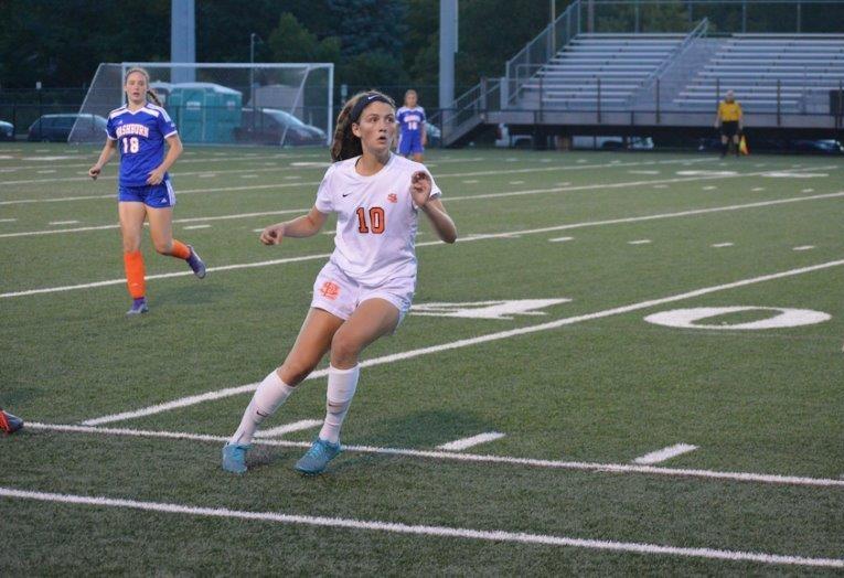 Sophomore Ellie Kent looks upfield while waiting for a pass to begin an offensive possession.