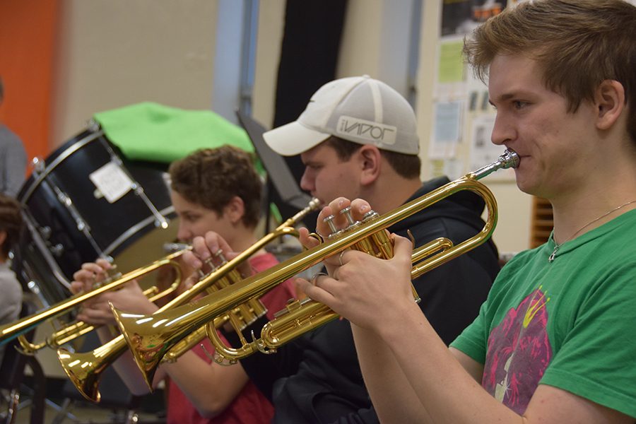 Junior Jake Henry plays the trumpet in his second hour band class Oct. 4.