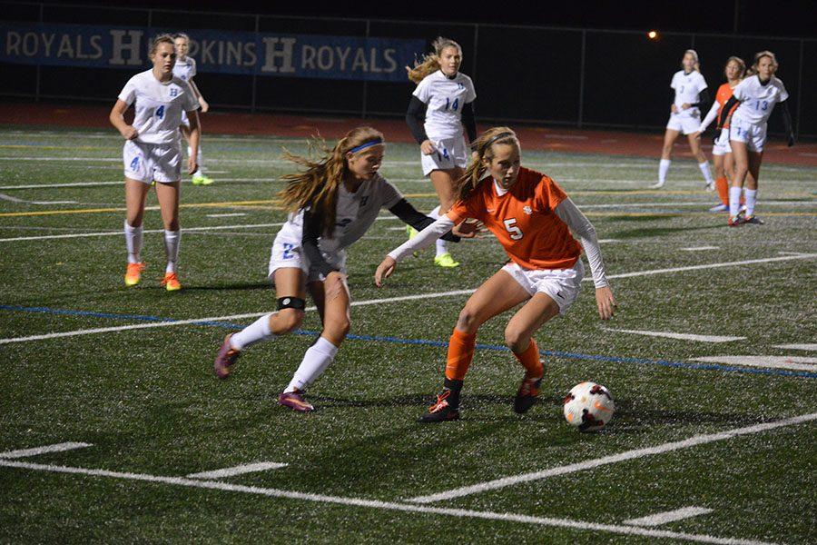 Senior Captain Sammi Baer protects the ball from the opponent. The Orioles lost 1-3 in the Oct. 13 game. 
