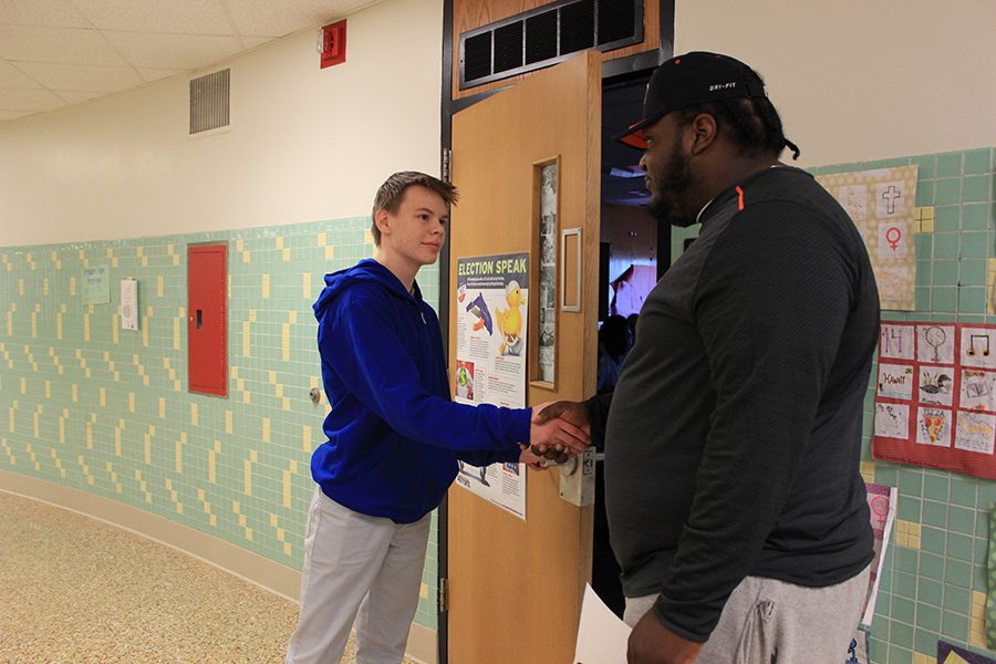 GLC Rob Griffin speaks with sophomore Jeremy Frahm as a part of the new atten- dance policy. Grade level coordinators are check- ing in with students
who have unexcused absences.