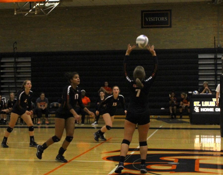 Junior Julia Austad sets the ball to senior Paige Steward. The Orioles are ranked sixth in their section.