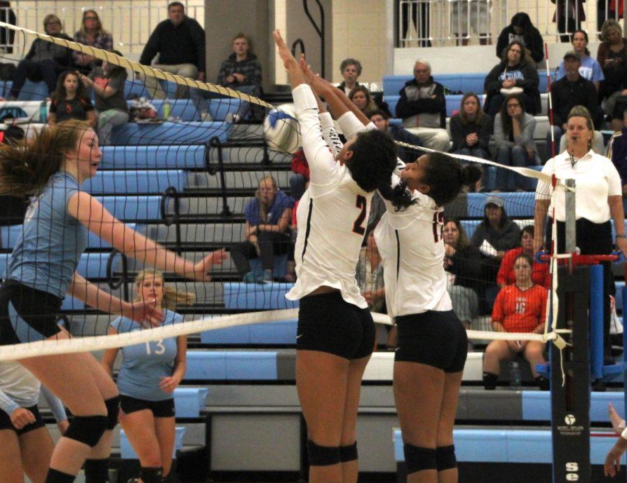 Junior captain Ella Trotter and senior Paige Steward block a hit during the second set. The team lost the first set 17-25, the second set 11-25 and the third set 22-25.
