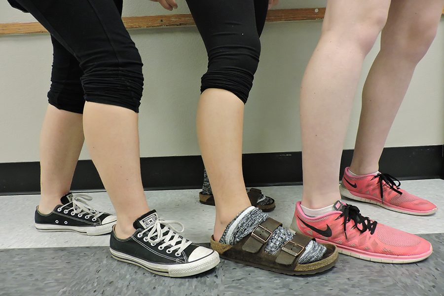 Three Park girls swimmers show their unshaved legs.