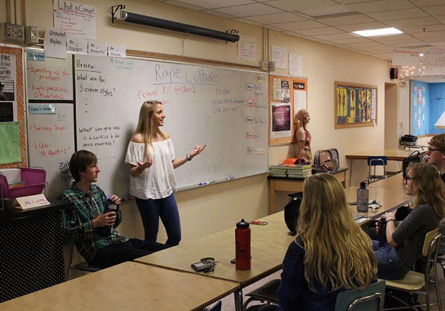 Junior SHEC co-president Izzi Gilbert Burke shares her opinion on Donald Trumps comments toward women at the meeting Oct. 27.