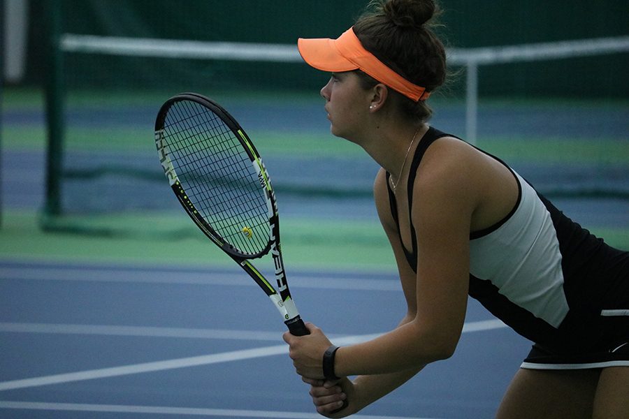 Senior Natalie Lorentz pays close attention to her opponent during her match on Monday. Lorentz had a strong showing at sections this year not losing a match until her second day.