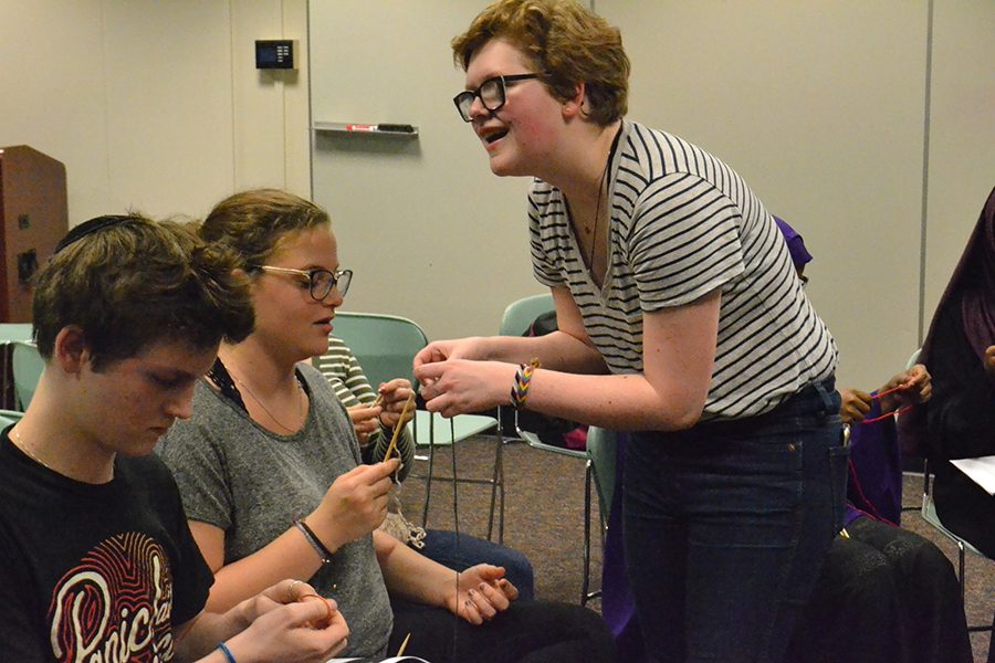 Senior Freja Olsen teaches members how to knit at the first meeting. Their next meeting will take place once she checks in with all the members availability. 