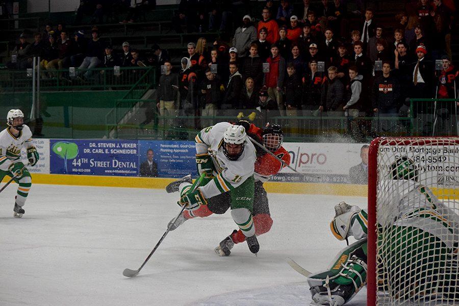 Junior Jonny Sorenson goes for the puck during the third period against Edina. Park lost to Edina 5-2. 