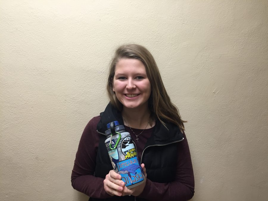 Senior Megan Aune shows off her Nalgene water bottle with stickers from a vacation to Alaska.
