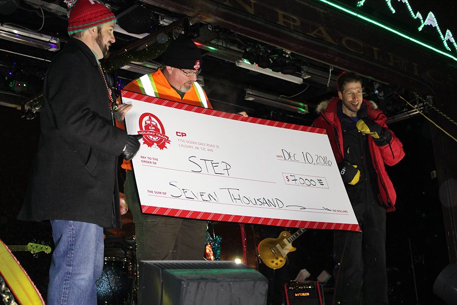 A check for $7,000 is presented to St. Louis Park Emergency Program (STEP). Not only is the Holiday Train a joyful experience, but it also aimed to raise money for local food shelves and food banks. 