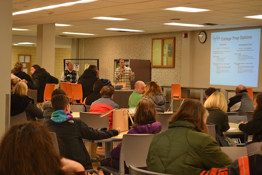A Sylvan Learning representative speaks to parents about the reults of the practice ACT on Jan. 5. 