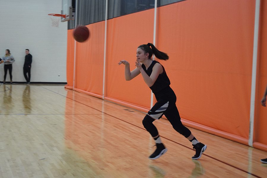 Freshman Shayla Miller practices drills during basketball practice Jan. 5. The team practices in different gyms at Park depending on where the boys team is practicing.