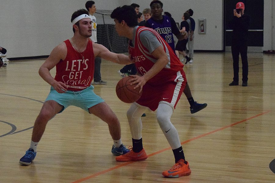 Senior Jack Elias guards ______ during their game at the 3x3 tournament for the Sno Daze week activities. 
