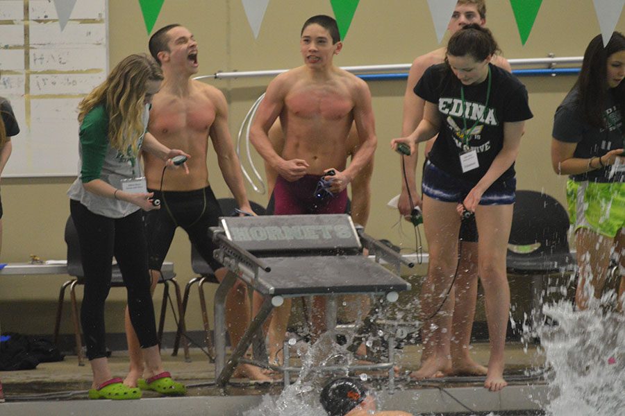 Junior David Salamzadeh and eighth grader Hayden Zheng celebrate winning the 200 medley relay. The State meet takes place at 6 p.m. Feb 3 at University of Minnesota Aquatic Center.  
