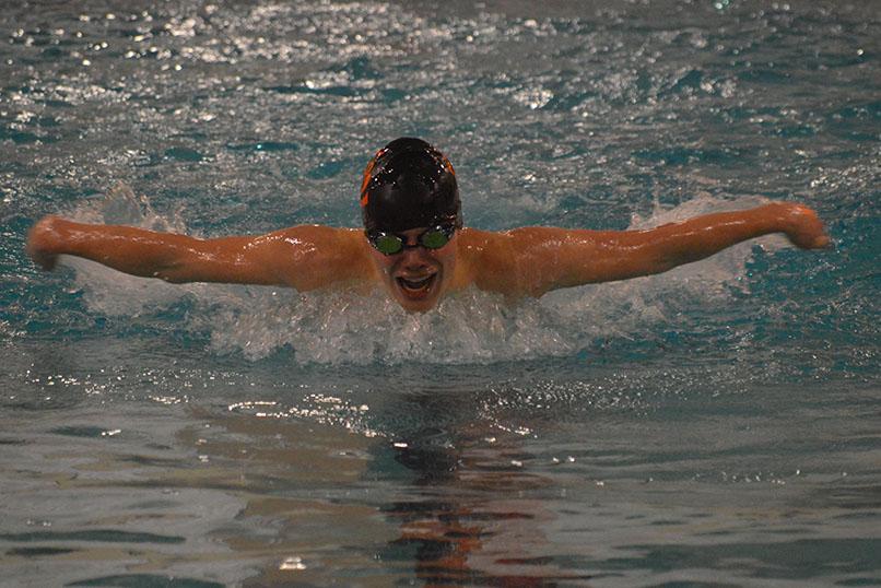 Freshman Will Mathews swims butterfly in the Section preliminary meet Feb. 23. He will swim in the Section finals Feb. 25.