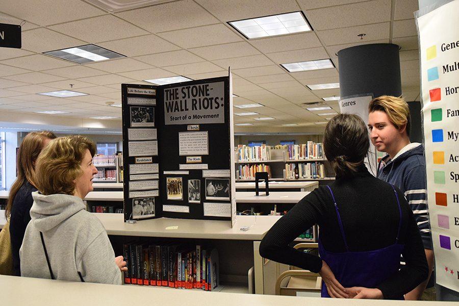 Seniors Dotan Appelbaum and Amira Stone present their History Day exhibit on the Stonewall Riots. Four projects from St. Louis Park High School qualified for the State Competition at Regionals.