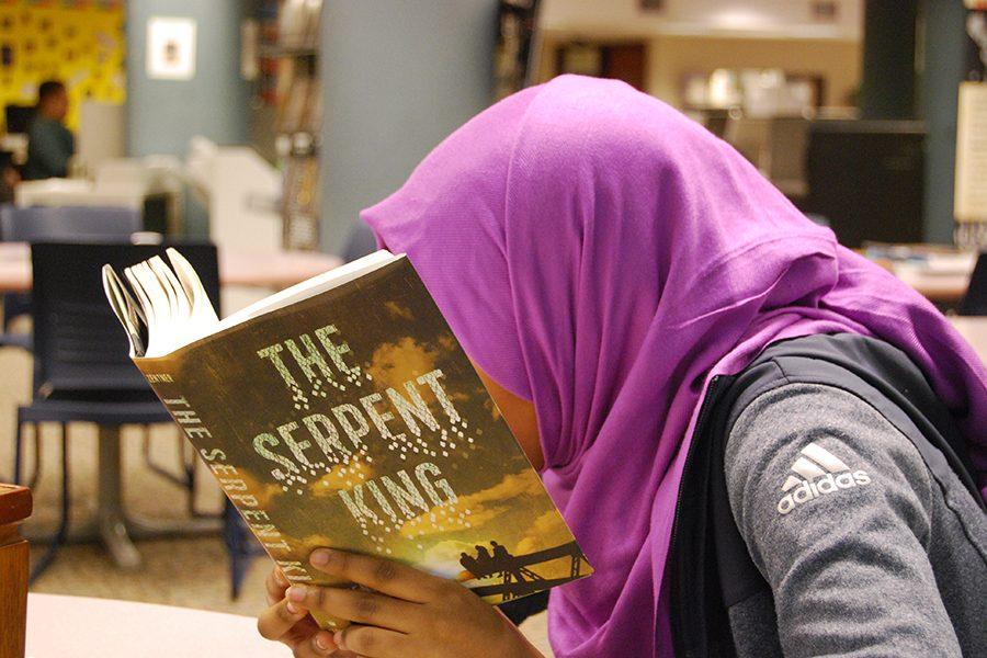 A+student+reads+The+Serpent+King+in+preparation+for+the+upcoming+book+discussion.+The+book+clubs+next+meeting+takes+place+March+14.