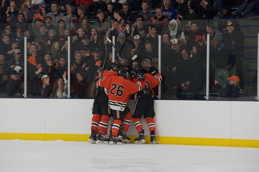 The Orioles celebrate after senior Bauer Neudecker scores  in the third period. It was Neudeckers 40th goal of the season.