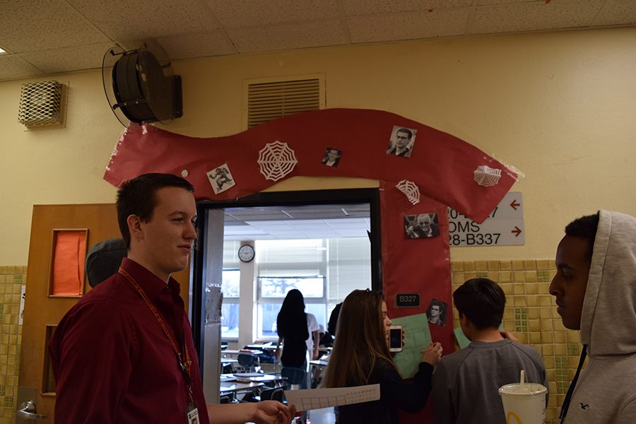 Math teacher Mr. Otto speaks with a student on Pi day, March 14. The math department put on a celebration of Pi for their students. 