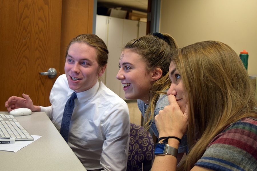 Senior Echo editors-in-chief Ethan Brown (left) and Maggie Bahnson (right) discuss content decisions with adviser Lori Keekley. Brown was recently named Minnesota High School Journalist of the Year March 10.