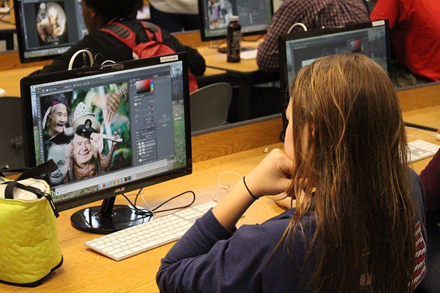 Sophomore Mary Gleason works on Adobe Photoshop during Photo 2. Photo 2 students are participating in an art contest for middle school and high school students centered around the theme of aging. 