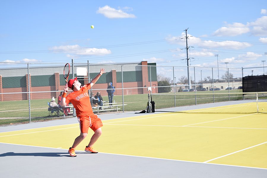 Junior Haim Lyubeznik prepares to serve the ball to his opponent in the Orioles match against Mound Westonka on April 11. Park lost by a score of 3-4.